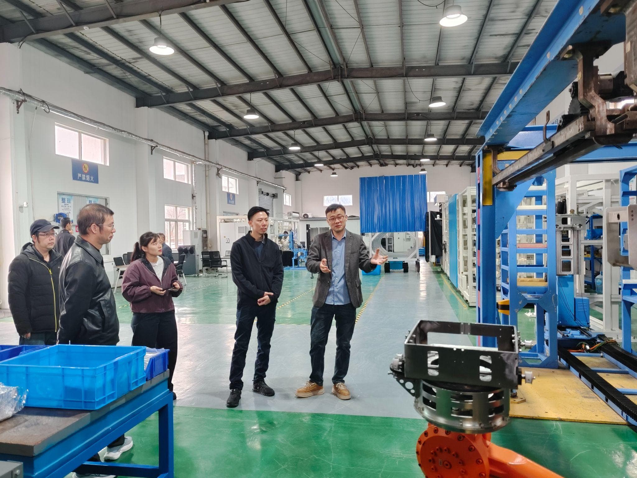 PSA representatives tour the equipment at the R&D center